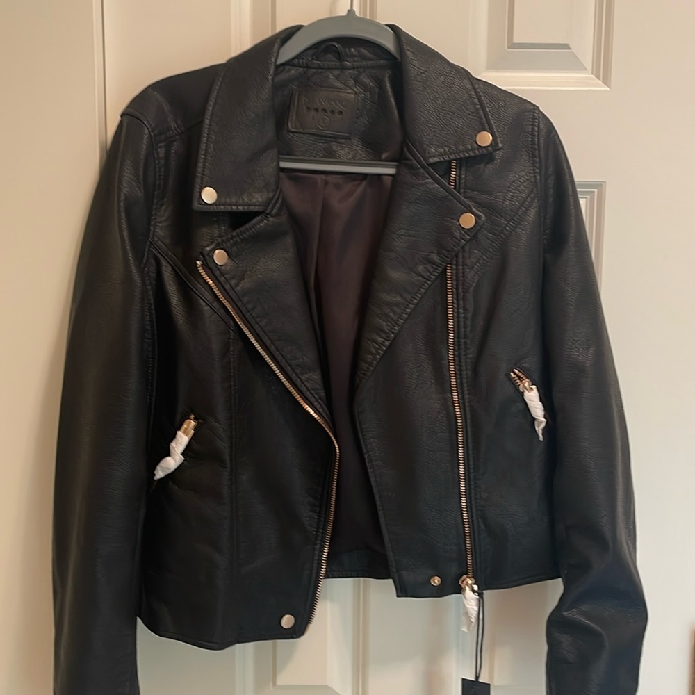 Black Moto jacket with gold hardware brand new never worn. Runs small.
